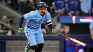 Toronto Blue Jays' George Springer watches his RBI-single against the Los Angeles Dodgers during the third inning in Game 6 of baseball's World Series, Friday, Oct. 31, 2025, in Toronto. (Brynn Anderson/AP)