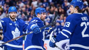 Toronto Maple Leafs' John Tavares (centre) celebrates his goal with teammates Oliver Ekman-Larsson (left) and Matthew Knies (23) during second period NHL hockey action against the Boston Bruins in Toronto, on Saturday, Nov. 8, 2025. THE CANADIAN PRESS/Sammy Kogan