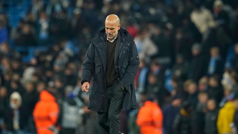 Manchester City's head coach Pep Guardiola walks on the pitch after the end of the Champions League opening phase soccer match between Manchester City and Bayer Leverkusen in Manchester, England, Tuesday, Nov. 25, 2025. (Dave Thompson/AP)