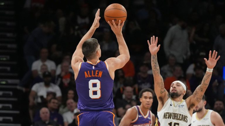 Phoenix Suns guard Grayson Allen (8) shoots a 3-pointer over New Orleans Pelicans guard Jose Alvarado (15) during the second half Monday, Nov. 10, 2025, in Phoenix. (AP Photo/Ross D. Franklin)