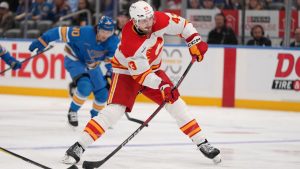 Calgary Flames' Adam Klapka (43) shoots during the first period of an NHL game against the St. Louis Blues Tuesday, Nov. 11, 2025, in St. Louis. (AP Photo/Jeff Roberson)
