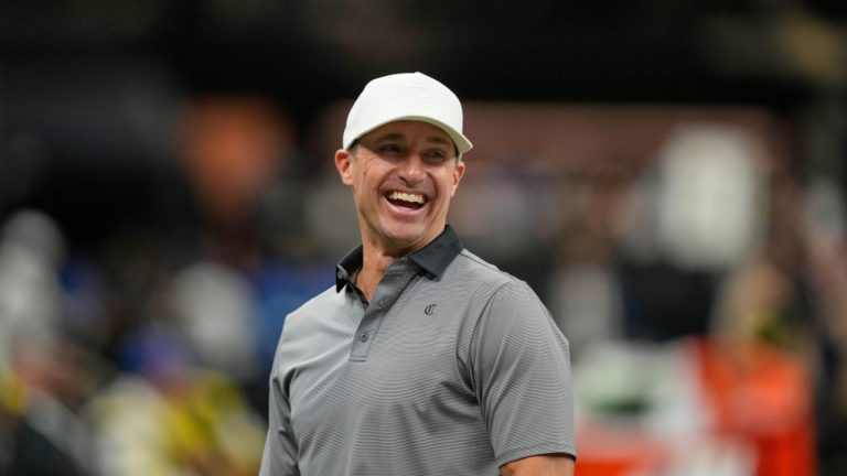 Former New Orleans Saints quarterback Drew Brees laughs near the bench before an NFL football game against the New York Giants in New Orleans, Sunday, Oct. 5, 2025. (Gerald Herbert/AP)