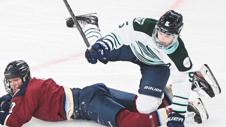 Montreal Victoire's Laura Stacey collides with Boston Fleet's Megan Keller during first period PWHL hockey action in Montreal, Saturday, March 1, 2025. (THE CANADIAN PRESS/Graham Hughes)