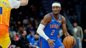 Oklahoma City Thunder guard Shai Gilgeous-Alexander (2) moves the ball against Charlotte Hornets centre Ryan Kalkbrenner during the second half of a game in Charlotte, N.C., Saturday, Nov. 15, 2025. (Nell Redmond/AP)