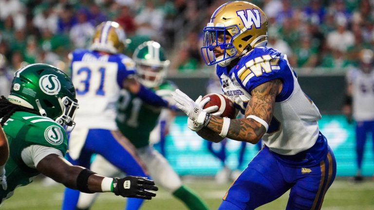 Winnipeg Blue Bombers defensive back Trey Vaval (23) runs the ball against the Saskatchewan Roughriders during the second half of CFL football action in Regina, Sunday, Aug. 31, 2025. (Heywood Yu/THE CANADIAN PRESS)