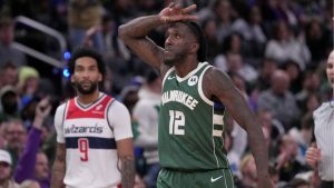 Milwaukee Bucks' Taurean Prince reacts to a three pointer during the second half of an NBA basketball game against the Washington Wizards Wednesday, Oct. 22, 2025, in Milwaukee. (AP Photo/Morry Gash)