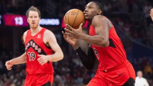 Toronto Raptors' RJ Barrett (drives to the basket as Jakob Poeltl looks on during the first half of an NBA game in Cleveland, Thursday, Nov. 13, 2025. (Phil Long/AP Photo)