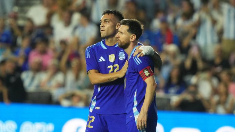 Argentina's Lautaro Martinez (left) celebrates his goal with Lionel Messi (right) during the second half of a friendly soccer match against Puerto Rico, Tuesday, Oct. 14, 2025, in Fort Lauderdale, Fla. (AP Photo/Marta Lavandier)