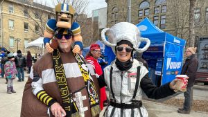 Football fans Steve and Sheree Bashak, of Brampton, Ont., are seen in Winnipeg on Friday, Nov. 14, 2025, ahead of Sunday's Grey Cup game. (Brittany Hobson/CP)