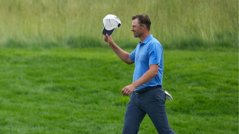 Victor Perez, of France, tips his cap as he walks up to the seventh tee after making a hole in one on the sixth hole during the second round of the U.S. Open golf tournament at Oakmont Country Club Friday, June 13, 2025, in Oakmont, Pa. (AP Photo/Seth Wenig)