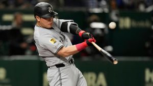 Yomiuri Giants' Kazuma Okamoto flies out in the second inning of a spring training baseball game against the Los Angeles Dodgersin Tokyo, Japan, Saturday, March 15, 2025. (Hiro Komae/AP)