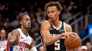 Atlanta Hawks guard Dyson Daniels (5) drives the ball against Detroit Pistons guard Daniss Jenkins during the first half of an NBA basketball game, Tuesday, Nov. 18, 2025, in Atlanta. (AP Photo/Erik Rank)