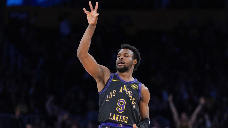 Los Angeles Lakers guard Bronny James (9) reacts after making a three-point basket during the second half of a game against the Utah Jazz Tuesday, Nov. 18, 2025, in Los Angeles. (AP Photo/Jae C. Hong)