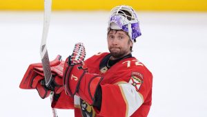 Florida Panthers goaltender Sergei Bobrovsky applauds toward fans after his team defeated the Vancouver Canucks in an NHL hockey game, Monday, Nov. 17, 2025, in Sunrise, Fla. (AP Photo/Rebecca Blackwell)