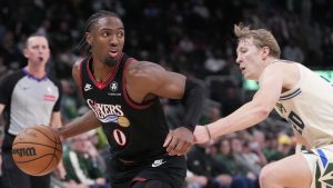 Philadelphia 76ers' Tyrese Maxey gets past Milwaukee Bucks' AJ Green during overtime of an NBA game Thursday, Nov. 20, 2025, in Milwaukee. (AP Photo/Morry Gash)