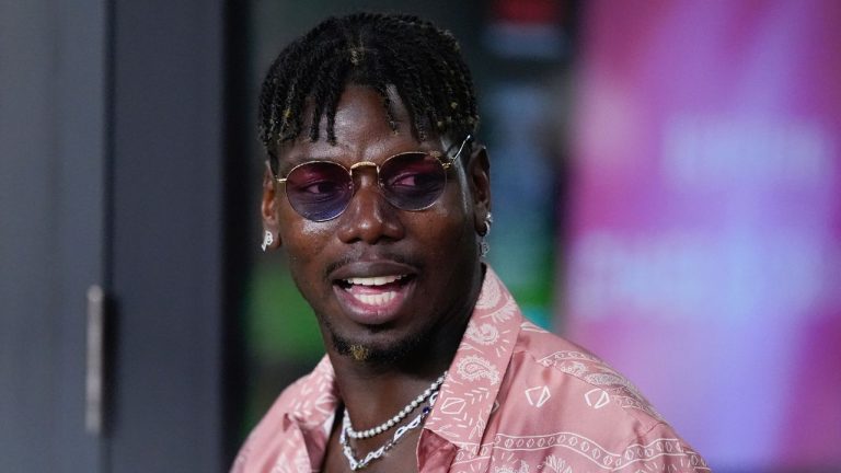 French professional soccer player Paul Pogba stands in a VIP suite at the start of an MLS match between Inter Miami and Charlotte FC, Saturday, Sept. 28, 2024, in Fort Lauderdale, Fla. (AP Photo/Rebecca Blackwell)