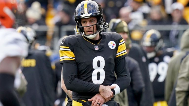 Pittsburgh Steelers quarterback Aaron Rodgers (8) holds his arm after a hit by the Cincinnati Bengals during the first half of an NFL game Sunday, Nov. 16, 2025, in Pittsburgh. (Matt Freed/AP)