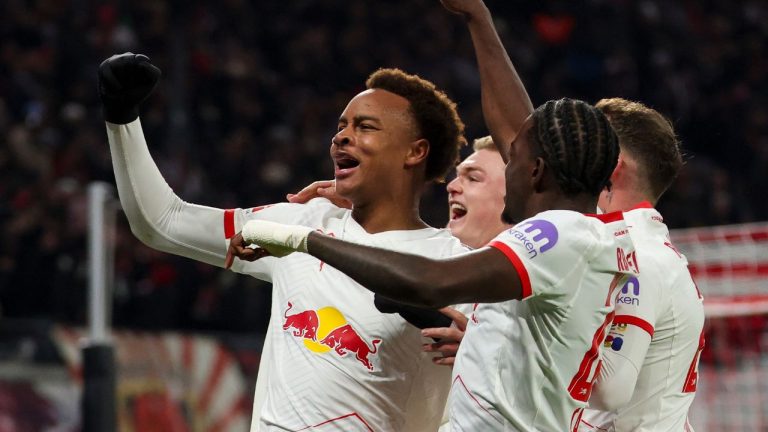 Leipzig's scorer Assan Ouedraogo, left, and his teammates celebrate the opening goal during the German Bundesliga Soccer match between RB Leipzig and Werder Bremen in Leipzig, Germany, Sunday, Nov. 23, 2025. (Jan Woitas/dpa via AP)