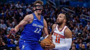 New York Knicks guard Jalen Brunson (11) goes to the basket as Orlando Magic forward Franz Wagner (22) defends him during the first half of an NBA basketball game, Saturday, Nov. 22, 2025, in Orlando, Fla. (Kevin Kolczynski/AP)