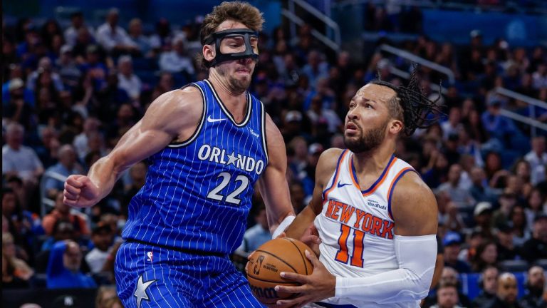 New York Knicks guard Jalen Brunson (11) goes to the basket as Orlando Magic forward Franz Wagner (22) defends him during the first half of an NBA basketball game, Saturday, Nov. 22, 2025, in Orlando, Fla. (Kevin Kolczynski/AP)