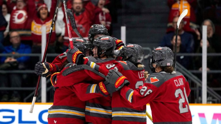 Ottawa Charge's Brianne Jenner (19) is surrounded by teammates after scoring against the Vancouver Goldeneyes during first period PWHL hockey action in Ottawa, on Wednesday, Nov. 26, 2025. (Justin Tang/CP)