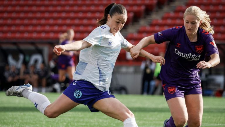 Ottawa Rapid's Delaney Baie Pridham, left, kicks the ball as Calgary Wild's Mijke Roelfsema closes in during second half Northern Super League soccer action in Calgary, on Sunday, May 11, 2025. (Jeff McIntosh/CP)