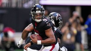 Atlanta Falcons quarterback Michael Penix Jr. drops back against the Carolina Panthers in the first half of an NFL football game, Sunday, Nov. 16, 2025, in Atlanta. (AP Photo/Brynn Anderson)