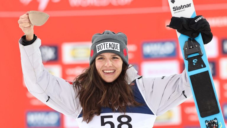 Canada's Abigail Strate celebrates after finishing second in the women's world cup ski jumping in Lillehammer, Norway, Saturday Nov. 22, 2025. (Geir Olsen/NTB Scanpix via AP)