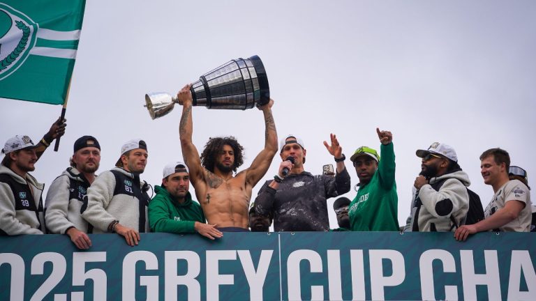 Saskatchewan Roughriders quarterback Trevor Harris (fourth from the right) speaks to spectators at Mosaic Stadium in Regina, Monday, Nov. 17, 2025. The Saskatchewan Roughriders defeated Montreal Alouettes on Sunday to become the 112th Grey Cup champions. (Heywood Yu/CP)