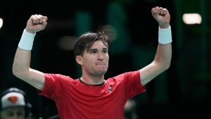 Belgium's Raphael Collignon celebrates after winning against France's Corentin Moutet during a Davis Cup quarterfinal singles tennis match between France and Belgium, in Bologna, Italy, Tuesday, Nov. 18, 2025. (Luca Bruno/AP)