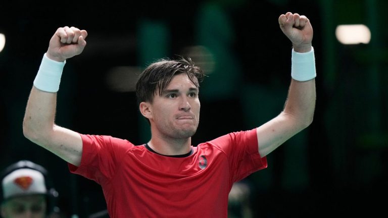 Belgium's Raphael Collignon celebrates after winning against France's Corentin Moutet during a Davis Cup quarterfinal singles tennis match between France and Belgium, in Bologna, Italy, Tuesday, Nov. 18, 2025. (Luca Bruno/AP)