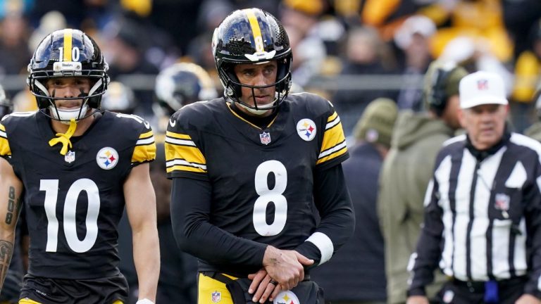 Pittsburgh Steelers quarterback Aaron Rodgers holds his arm after a hit by the Cincinnati Bengals during the first half of an NFL football game Sunday, Nov. 16, 2025, in Pittsburgh. (AP Photo/Matt Freed)