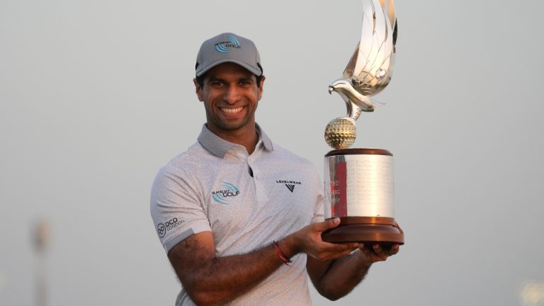 Aaron Rai of England poses with the trophy after winning the Abu Dhabi Golf Championship in Abu Dhabi, United Arab Emirates, Sunday, Nov. 9, 2025. (Altaf Qadri/AP)