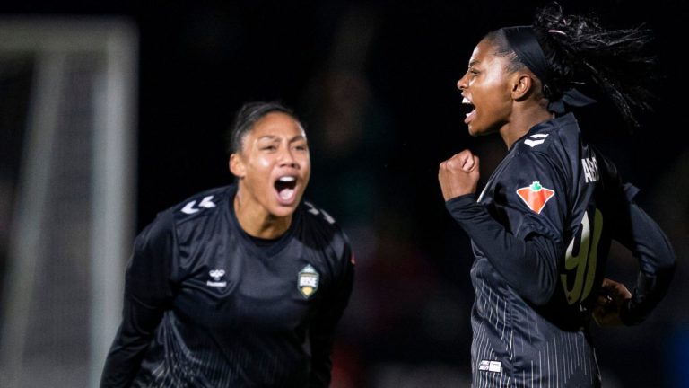 Vancouver Rise's Latifah Abdu (right) celebrates with teammate Jessika Cowart after scoring a goal against Ottawa Rapid FC during the first half of an NSL semifinal soccer match, in Burnaby, B.C., on Tuesday, Nov. 4, 2025. (Rich Lam/THE CANADIAN PRESS)