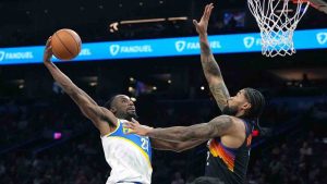 Indiana Pacers guard Aaron Nesmith (23) drives on Phoenix Suns center Nick Richards during the second half of an NBA basketball game, Thursday, Nov. 13, 2025, in Phoenix. (Rick Scuteri/AP)