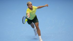 Spain's Carlos Alcaraz returns the ball to United States' Taylor Fritz during their tennis match of the ATP World Tour Finals, in Turin, Italy, Tuesday, Nov. 11, 2025. (Antonio Calanni/AP)
