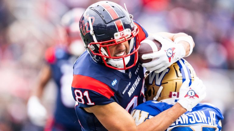 Winnipeg Blue Bombers' Dexter Lawson (27) defends against Montreal Alouettes' Austin MacK (81) during first half Eastern semi-final action, in Montreal on Saturday, Nov. 1, 2025. (Christopher Katsarov/THE CANADIAN PRESS)