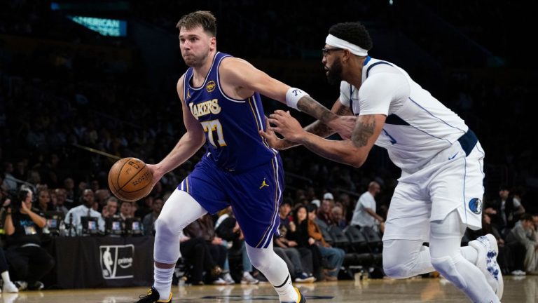 Los Angeles Lakers guard Luka Doncic (77) drives to the basket as Dallas Mavericks forward Anthony Davis (3) defends during the second half of an NBA Cup basketball game in Los Angeles, Friday, Nov. 28, 2025. (Kyusung Gong/AP)