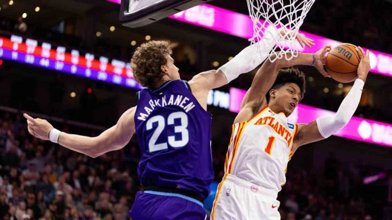 Atlanta Hawks forward Jalen Johnson (1) gets a rebound over Utah Jazz forward Lauri Markkanen (23) during the second half of an NBA basketball game, Thursday, Nov. 13, 2025, in Salt Lake City. (Anna Fuder/AP)