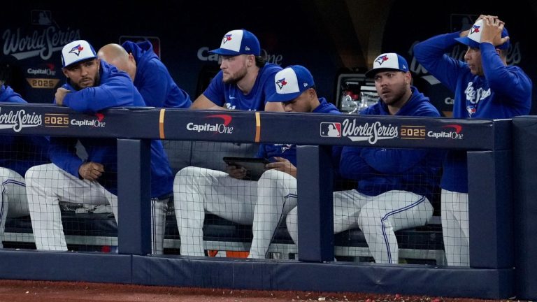 Toronto Blue Jays players watch from their dugout during the 10th inning in Game 7 of baseball's World Series against the Los Angeles Dodgers, Saturday, Nov. 1, 2025, in Toronto. (Ashley Landis/AP)