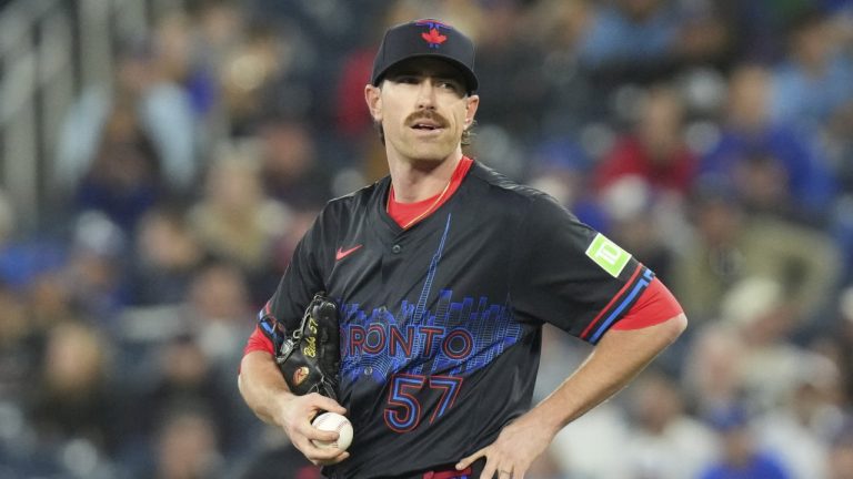 Toronto Blue Jays pitcher Shane Bieber (57) reacts after giving up a solo home run to Milwaukee Brewers' Andruw Monasterio  during sixth inning MLB baseball action in Toronto on Friday, August 29, 2025. (Chris Young/CP)