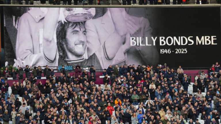 A giant screen displays a Wast Ham legend Billy Bonds died aged 79 prior to the start of the English Premier League soccer match between West Ham United and Liverpool, in London, Sunday, Nov. 30, 2025. (Kirsty Wigglesworth/AP)