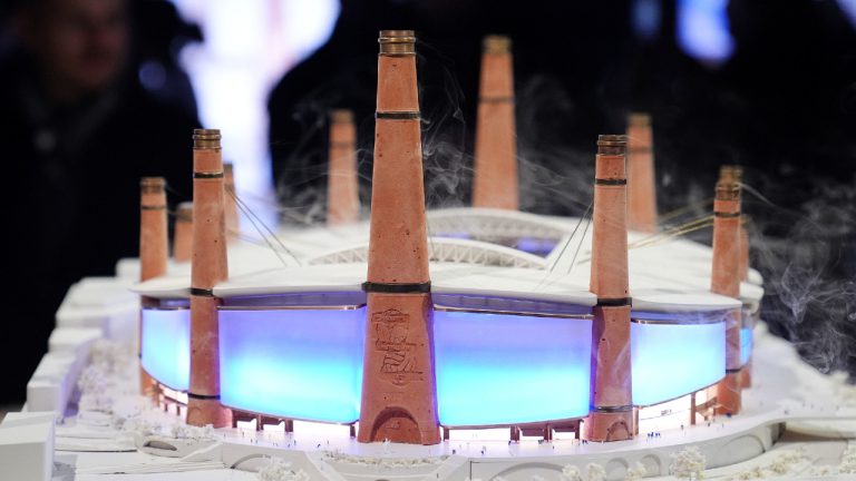 Pepole look at a Diorama of Birmingham City Football Club's new stadium plans during the unveiling in Birmingham, England, Thursday, Nov. 20, 2025. (Jacob King/PA via AP)
