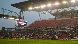 Fans clear the stands in heavy rain after the match was postposed due to a weather delay during the first half of the 2025 NSL final in Toronto, on Saturday, Nov. 15, 2025. (Sammy Kogan/CP)