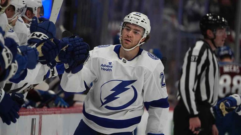 Tampa Bay Lightning center Brayden Point (21) is congratulated as he passes the team box after scoring a goal against the Colorado Avalanche in the third period of an NHL hockey game. (David Zalubowski/AP)