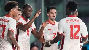 Canada midfielder Ismael Kone (8) celebrates with teammates including midfielder Stephen Eustaquio (7) after scoring his side's first goal against Venezuela during the first half of an international friendly soccer match, Tuesday, Nov. 18, 2025, in Fort Lauderdale, Fla. (Rebecca Blackwell/AP)