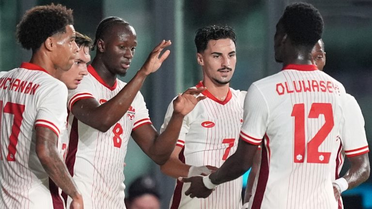 Canada midfielder Ismael Kone (8) celebrates with teammates including midfielder Stephen Eustaquio (7) after scoring his side's first goal against Venezuela during the first half of an international friendly soccer match, Tuesday, Nov. 18, 2025, in Fort Lauderdale, Fla. (Rebecca Blackwell/AP)