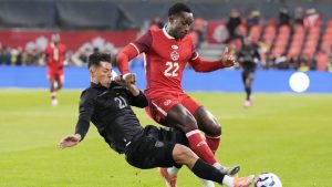 Canada's Richie Laryea, right, is tackled by Ecuador's Alan Franco Palma during first half international friendly soccer action, in Toronto, on Thursday, November 13, 2025. (Chris Young/CP)