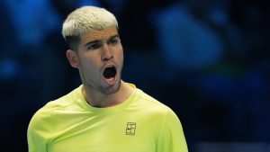 Spain's Carlos Alcaraz reacts after winning a point against Australia's Alex de Minaur during their singles tennis match of the ATP World Tour Finals, in Turin, Italy, Sunday, Nov. 9, 2025. (Antonio Calanni/AP)