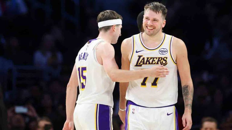 Los Angeles Lakers guard Luka Doncic, right, and Los Angeles Lakers guard Austin Reaves (15) celebrate during the second half of an NBA basketball game against the Miami Heat, Sunday, Nov. 2, 2025, in Los Angeles. (Jessie Alcheh/AP)